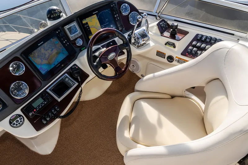  Yacht Photos Pics 2009 Meridian 391 Sedan helm with navigation screens, gauges, and a comfortable captain's chair.
