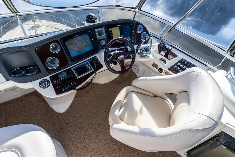  Yacht Photos Pics Luxurious 2009 Meridian 391 Sedan helm with advanced navigation systems and plush seating.