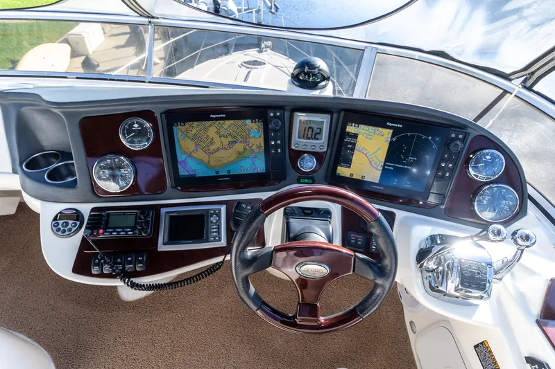  Yacht Photos Pics 2009 Meridian 391 Sedan helm with navigation screens and controls.