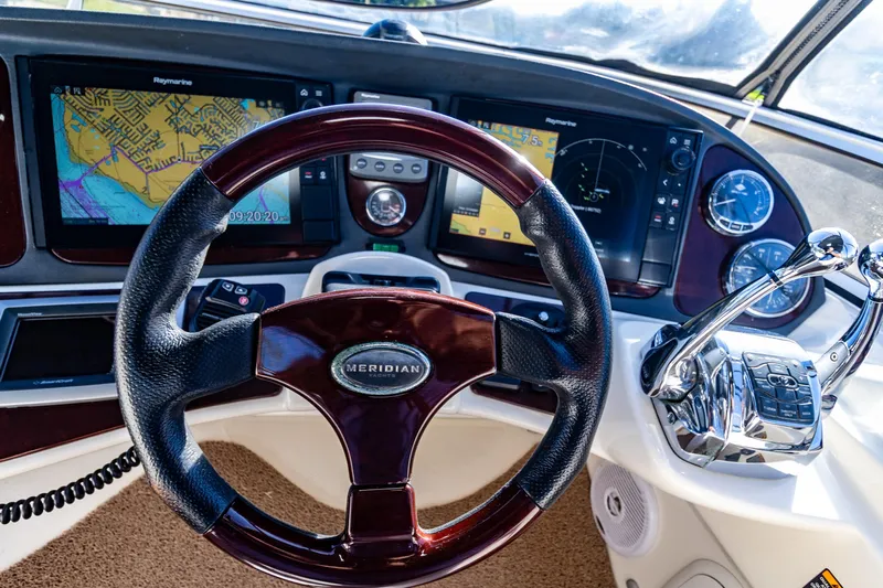  Yacht Photos Pics 2009 Meridian 391 Sedan helm with navigation screens and controls.