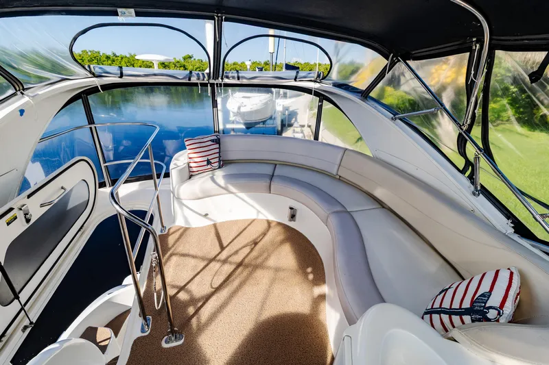  Yacht Photos Pics Luxurious 2009 Meridian 391 Sedan yacht interior with plush seating and nautical decor.