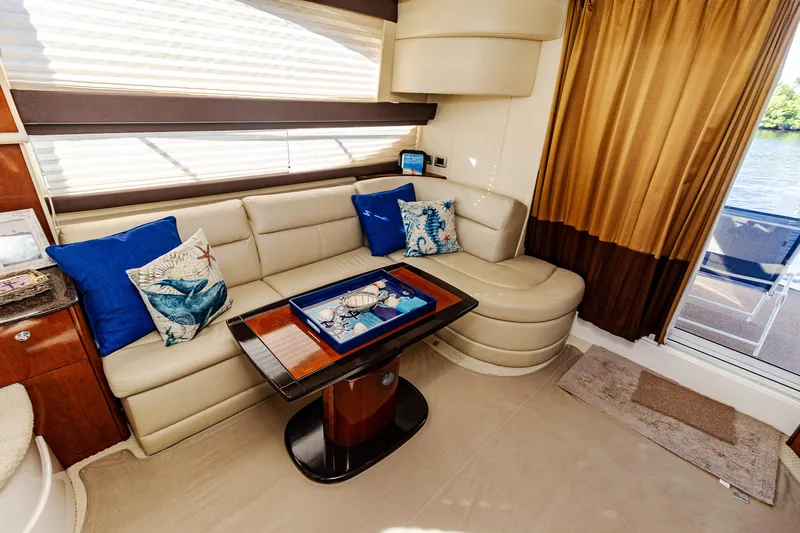  Yacht Photos Pics Luxurious interior of 2009 Meridian 391 Sedan yacht with plush seating and decorative pillows.