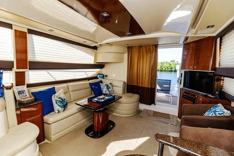  Yacht Photos Pics Luxurious interior of 2009 Meridian 391 Sedan yacht with elegant seating and scenic water view.