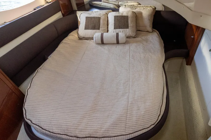  Yacht Photos Pics Luxurious 2009 Meridian 391 Sedan cabin with elegant bedding and plush pillows.