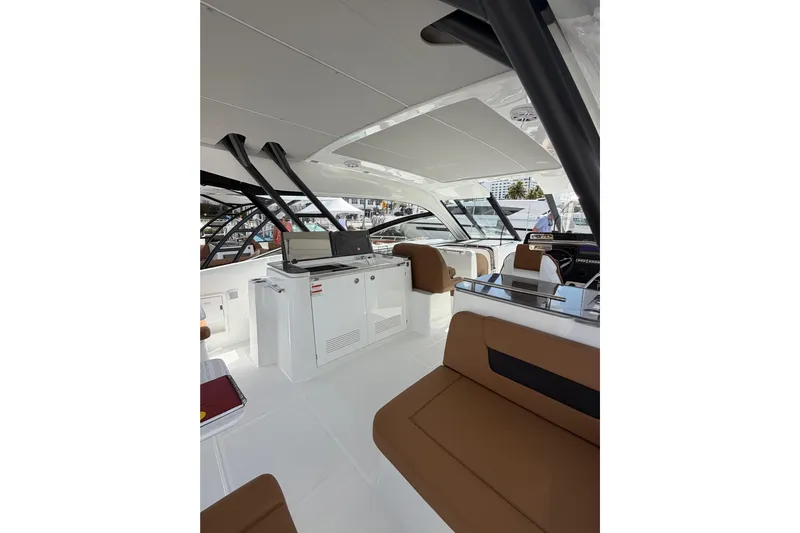  Yacht Photos Pics Luxurious interior of 2026 Jeanneau TH38 yacht with modern seating and sleek design.