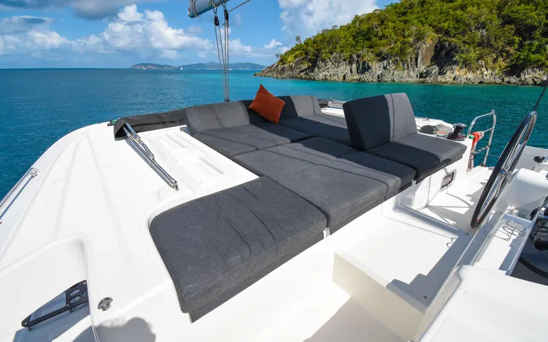 Celavie Yacht Photos Pics Luxurious 2021 Lagoon 46 catamaran with spacious deck, scenic ocean view, and comfortable seating.