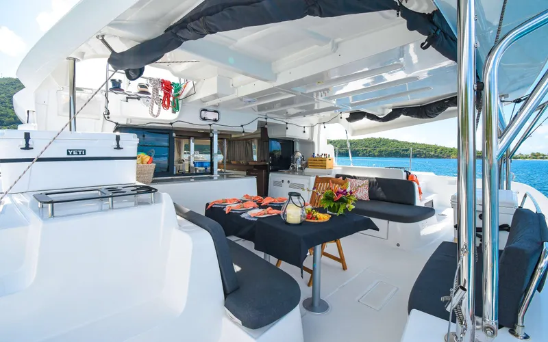 Celavie Yacht Photos Pics Luxurious 2021 Lagoon 46 yacht interior with dining area, ocean view, and modern amenities.