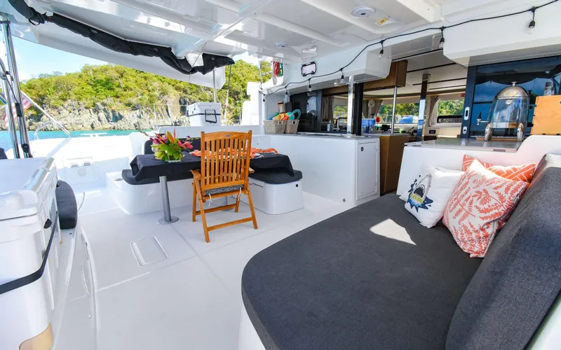 Celavie Yacht Photos Pics Luxurious Lagoon 46 catamaran interior, featuring modern seating and dining area, 2021 model.