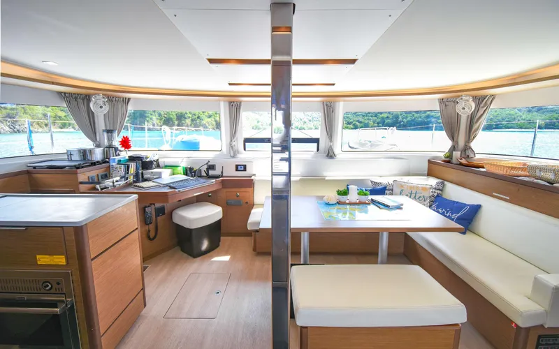 Celavie Yacht Photos Pics Interior of 2021 Lagoon 46 catamaran, featuring modern kitchen and dining area with scenic views.