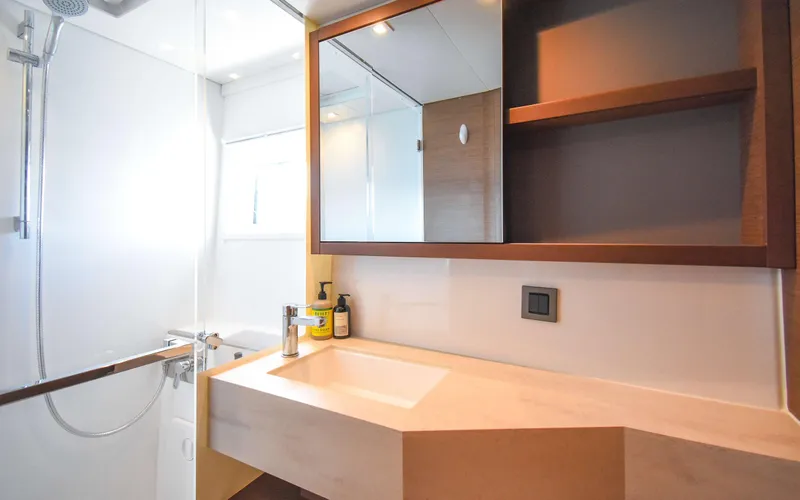 Celavie Yacht Photos Pics Modern bathroom in 2021 Lagoon 46 yacht with sleek sink and shower.