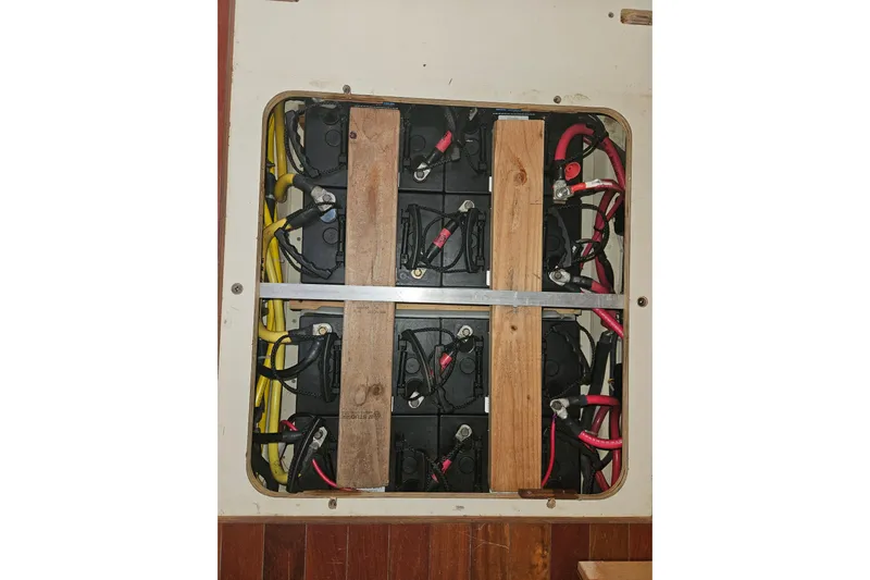 Soirse Yacht Photos Pics Battery compartment of 2013 Marlow-Hunter 50 aft cabin with wiring and wooden supports.