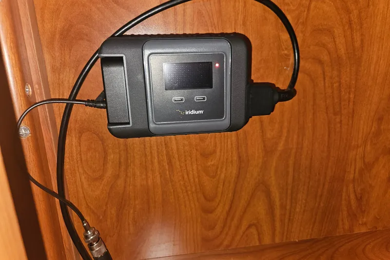 Soirse Yacht Photos Pics Satellite communication device mounted on a wooden panel in a 2013 Marlow-Hunter 50 aft cabin.