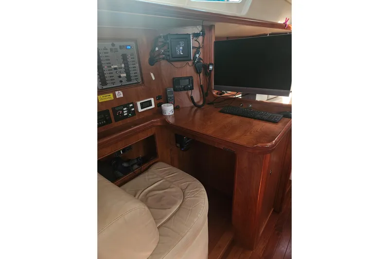 Soirse Yacht Photos Pics Navigation station in 2013 Marlow-Hunter 50 aft cabin yacht with control panel and monitor.