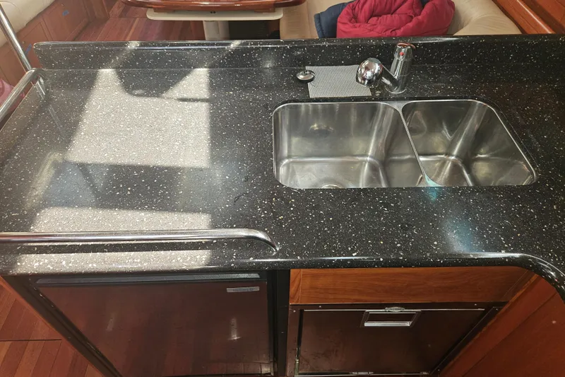 Soirse Yacht Photos Pics Luxurious kitchen sink area in 2013 Marlow-Hunter 50 aft cabin yacht.