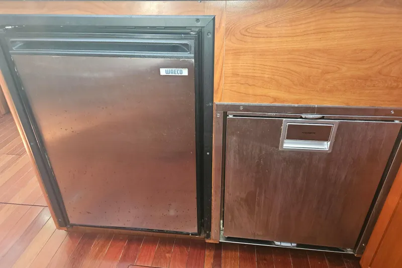 Soirse Yacht Photos Pics Stainless steel fridge and dishwasher in 2013 Marlow-Hunter 50 aft cabin yacht kitchen.