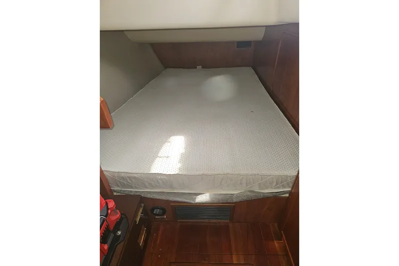 Soirse Yacht Photos Pics 2013 Marlow-Hunter 50 aft cabin with a cozy bed and wooden interior.