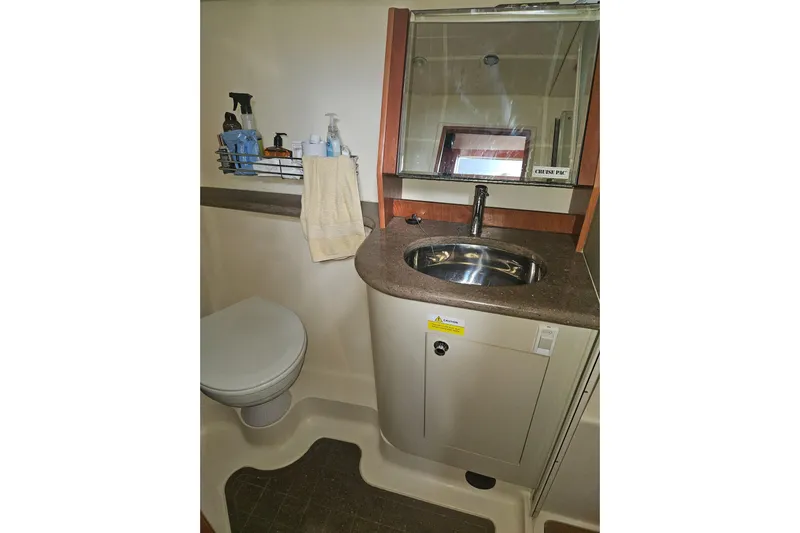 Soirse Yacht Photos Pics Bathroom in 2013 Marlow-Hunter 50 aft cabin yacht, featuring sink and toilet.