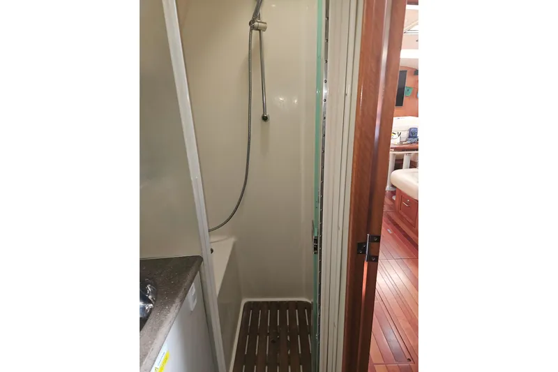Soirse Yacht Photos Pics Shower area in 2013 Marlow-Hunter 50 aft cabin yacht, featuring wooden flooring.