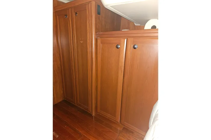 Soirse Yacht Photos Pics 2013 Marlow-Hunter 50 aft cabin interior with wooden cabinets and flooring.