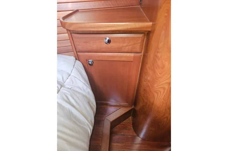 Soirse Yacht Photos Pics Wooden cabinetry in 2013 Marlow-Hunter 50 aft cabin, featuring sleek design and polished finish.