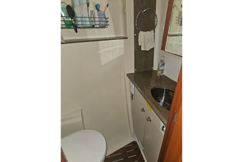Soirse Yacht Photos Pics 2013 Marlow-Hunter 50 aft cabin bathroom with sink, toilet, and toiletries.