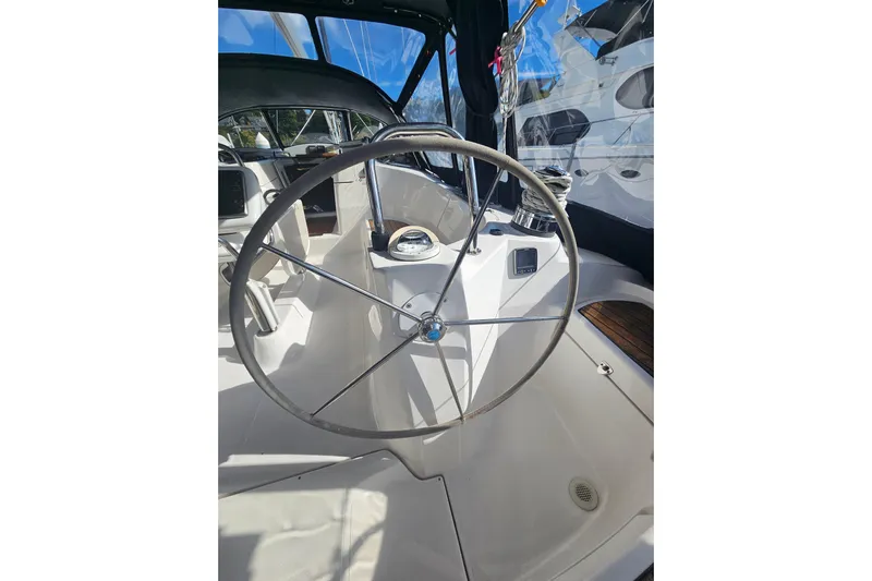Soirse Yacht Photos Pics Steering wheel of 2013 Marlow-Hunter 50 aft cabin sailboat, featuring modern cockpit design.
