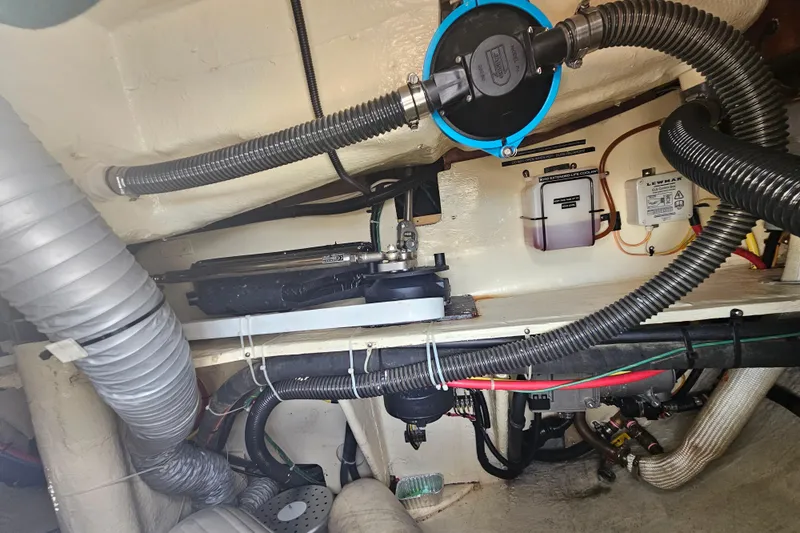 Soirse Yacht Photos Pics Engine room of 2013 Marlow-Hunter 50 aft cabin yacht with visible hoses and equipment.