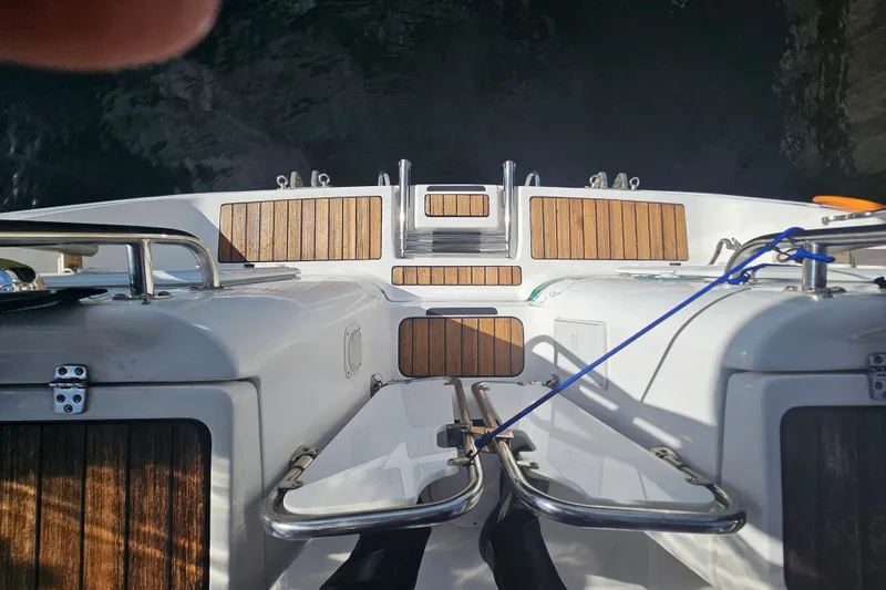 Soirse Yacht Photos Pics Aft deck of 2013 Marlow-Hunter 50, featuring teak flooring and stainless steel railings.