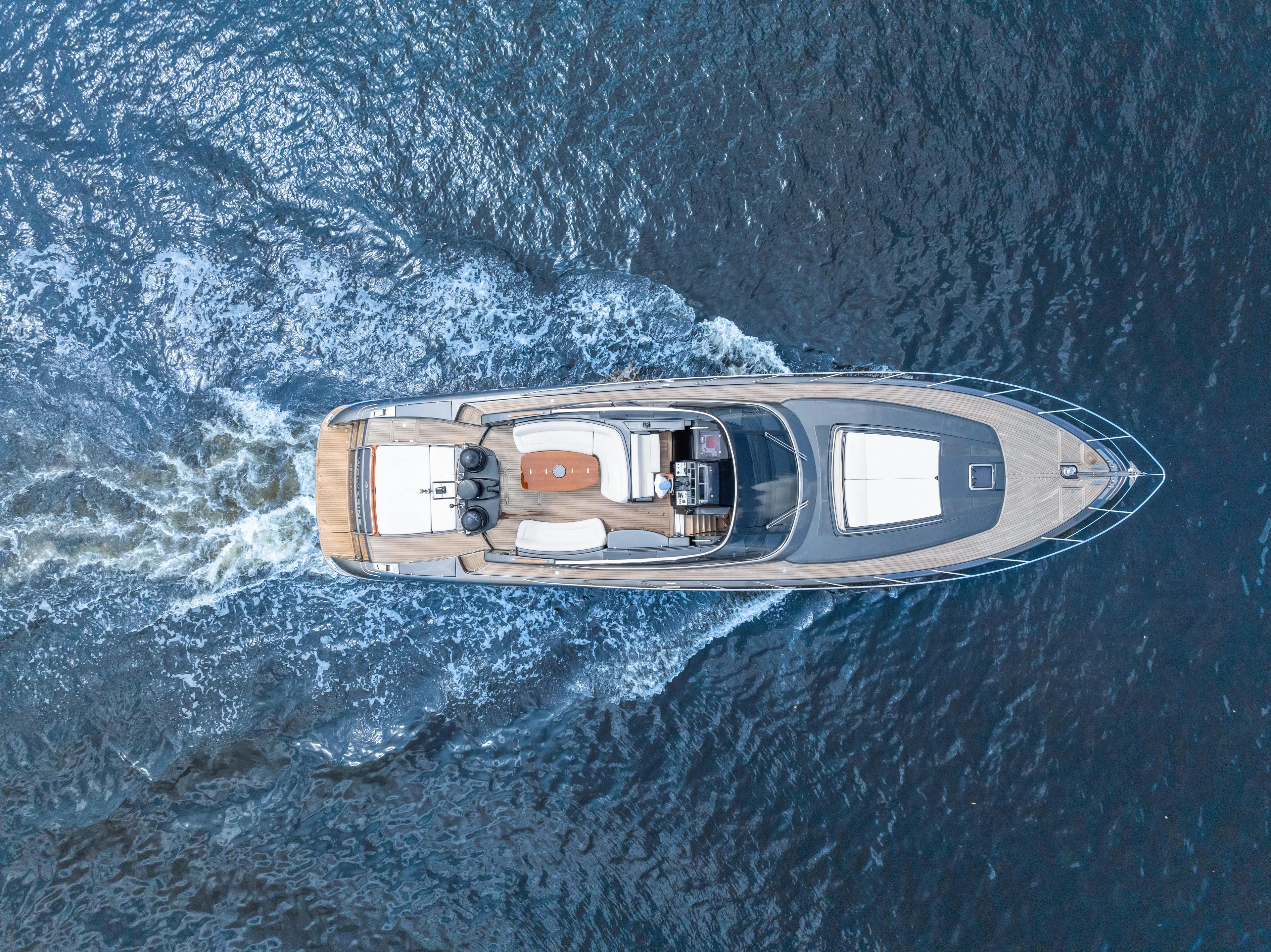 Wolverine Yacht Photos Pics Aerial view of 2015 Riva 63 Virtus yacht cruising on open water.