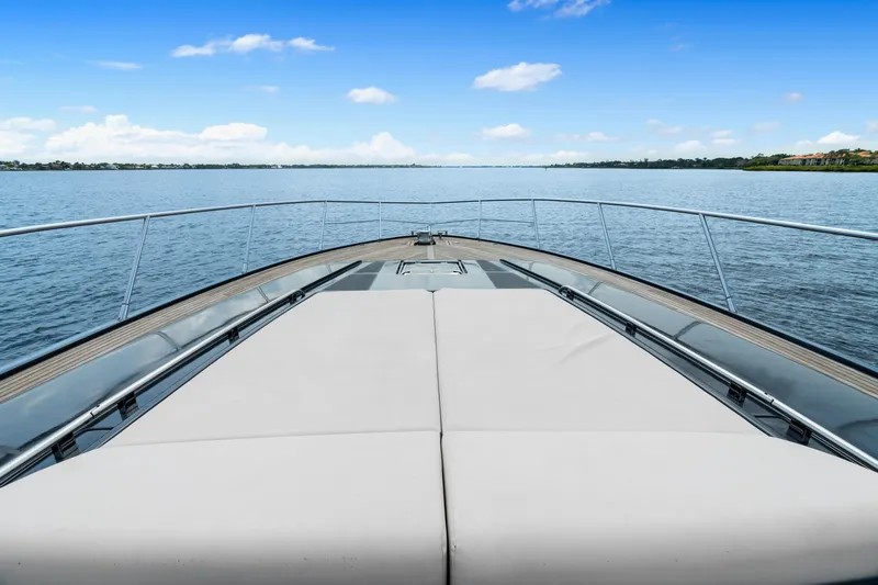 Wolverine Yacht Photos Pics 2015 Riva 63 Virtus yacht deck with serene water view.
