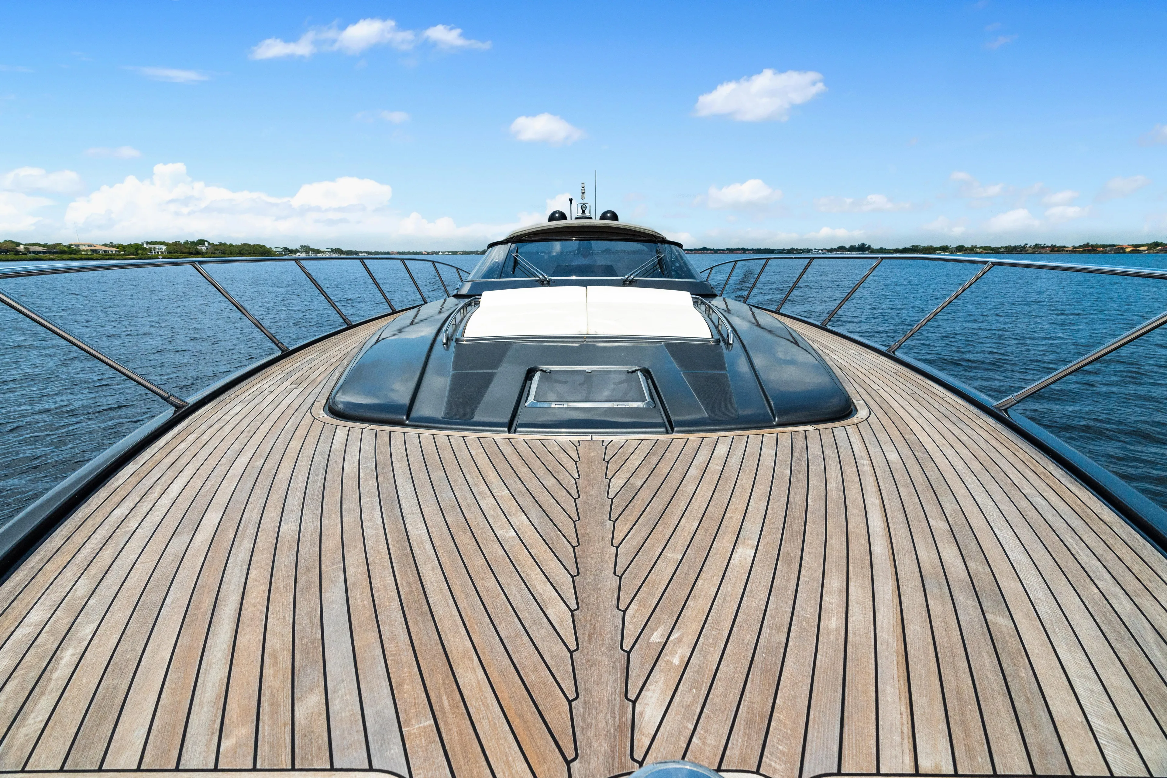 Wolverine Yacht Photos Pics Luxurious 2015 Riva 63 Virtus yacht with sleek wooden deck on open water.