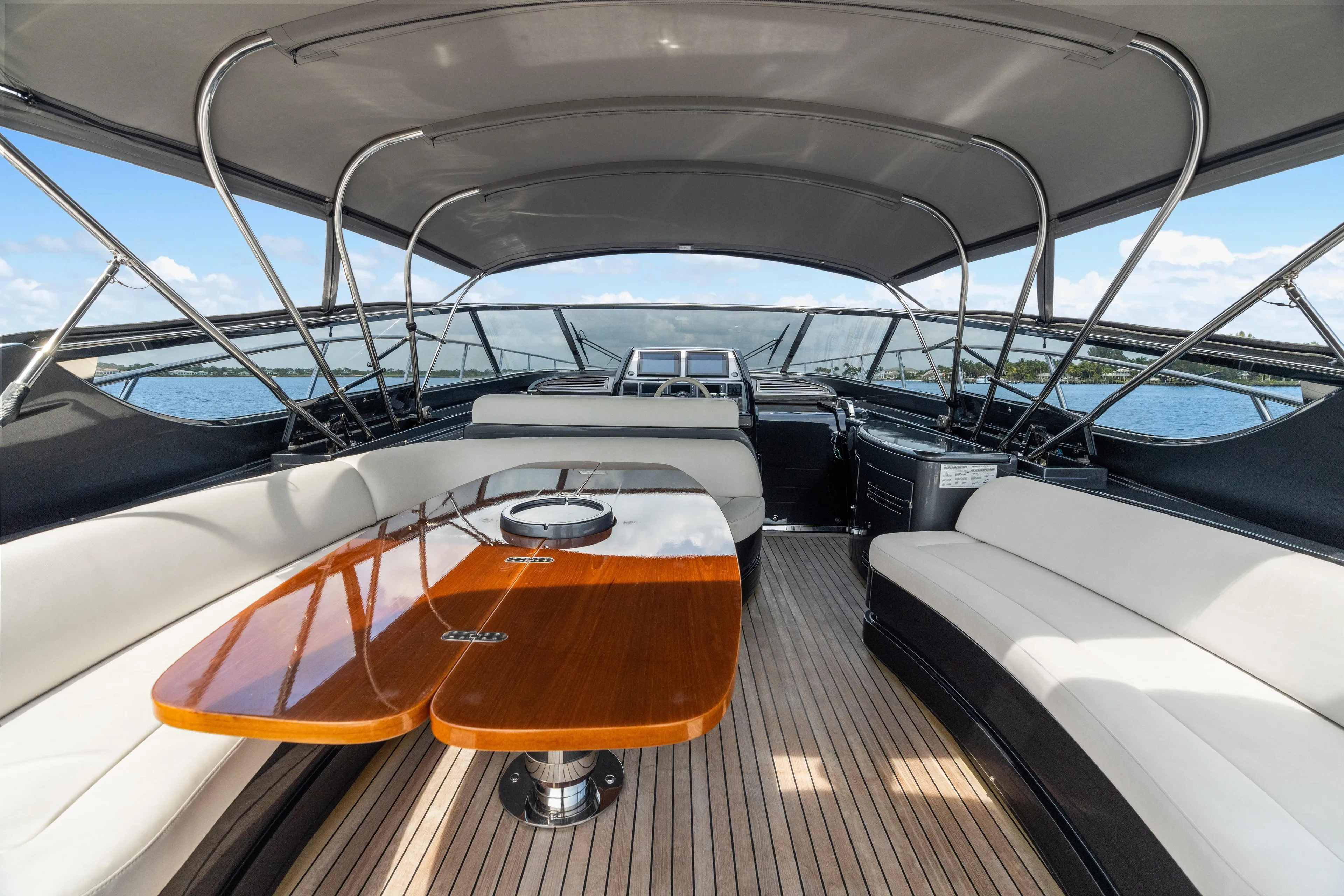Wolverine Yacht Photos Pics Luxurious 2015 Riva 63 Virtus yacht interior with elegant seating and wooden table.