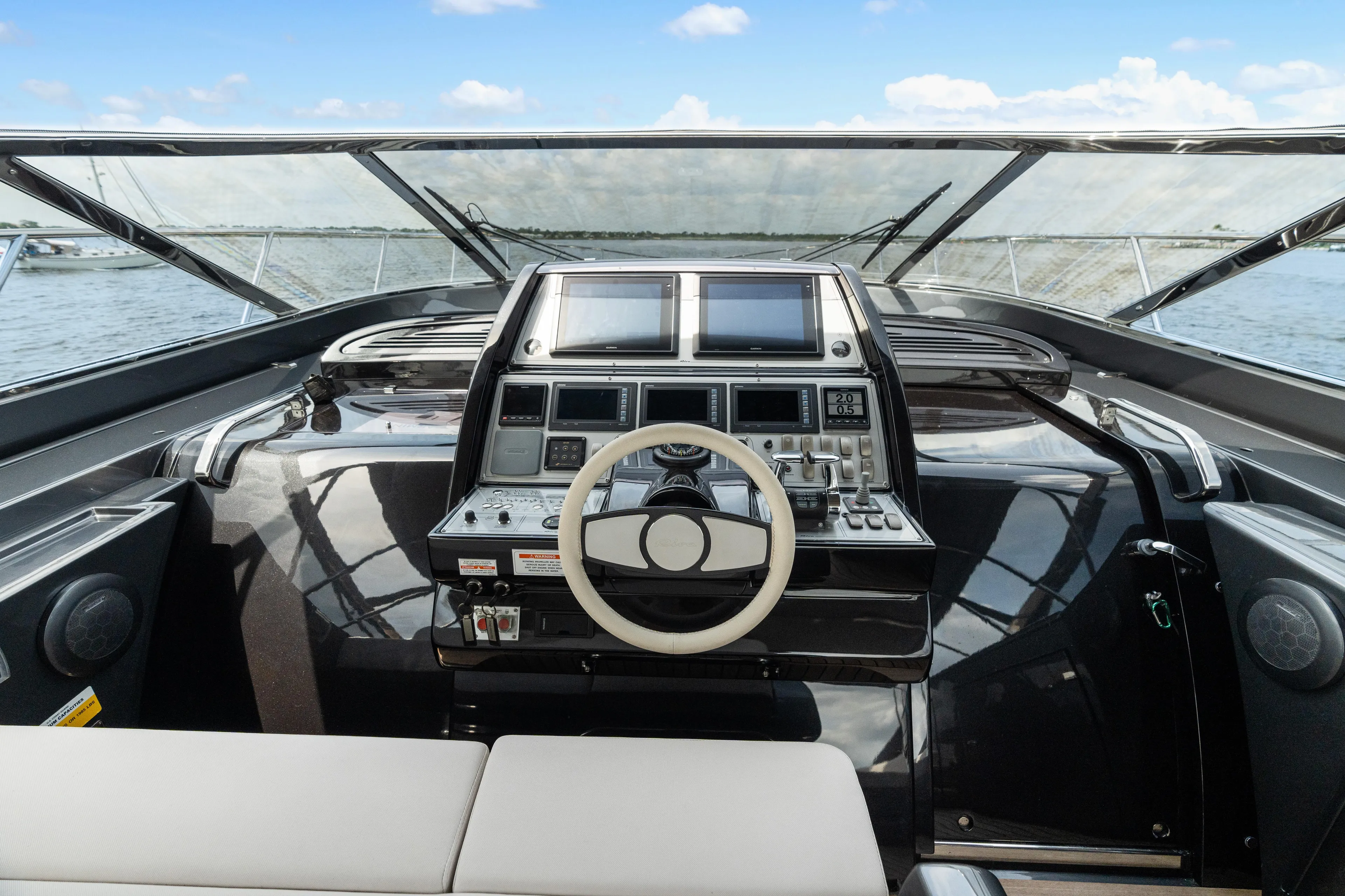 Wolverine Yacht Photos Pics Cockpit of 2015 Riva 63 Virtus yacht with modern controls and steering wheel.