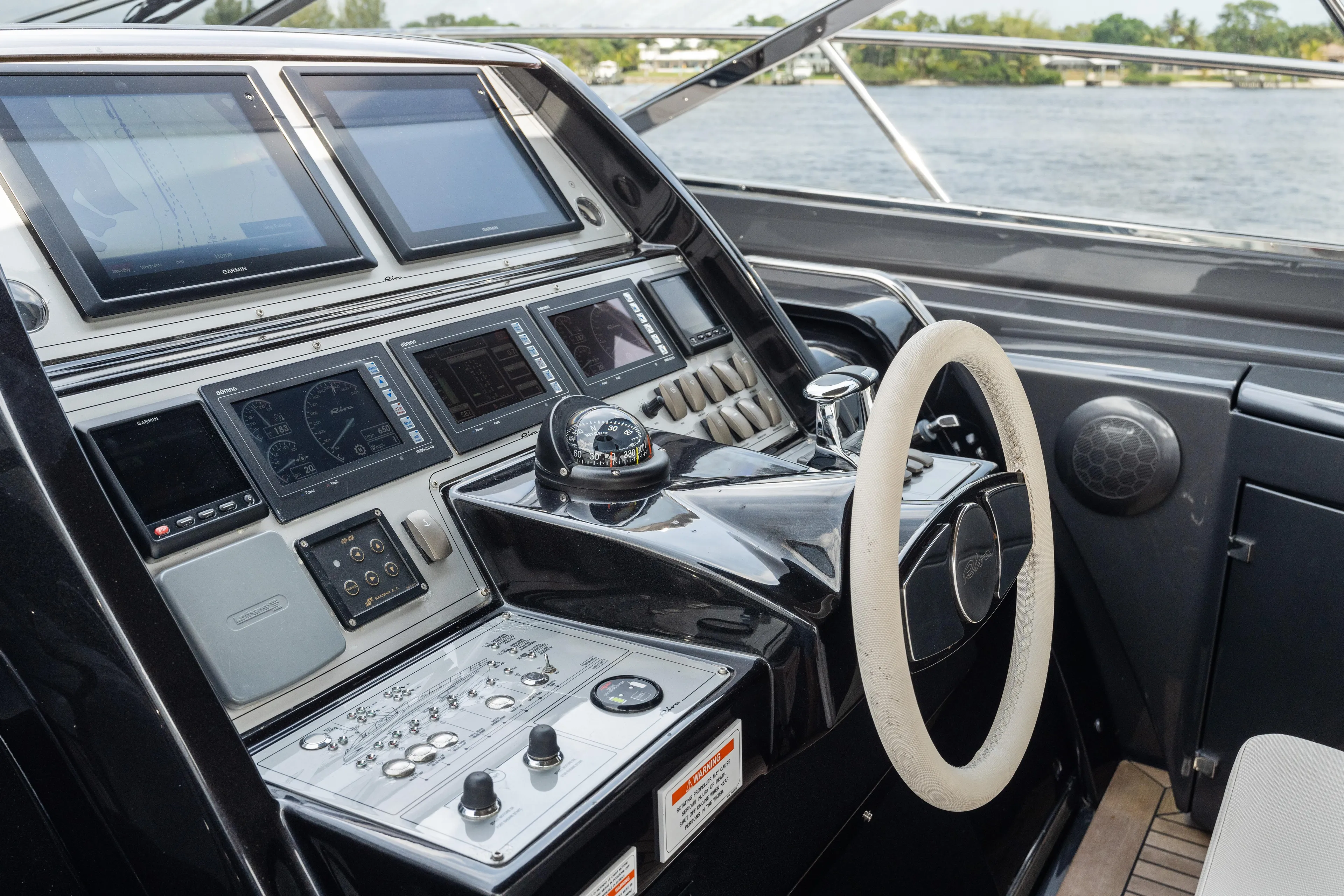 Wolverine Yacht Photos Pics Cockpit of 2015 Riva 63 Virtus yacht with advanced navigation controls and steering wheel.