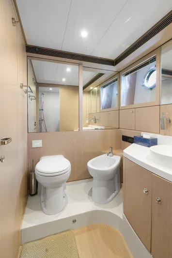 Wolverine Yacht Photos Pics Luxurious bathroom interior of 2015 Riva 63 Virtus yacht with modern fixtures.