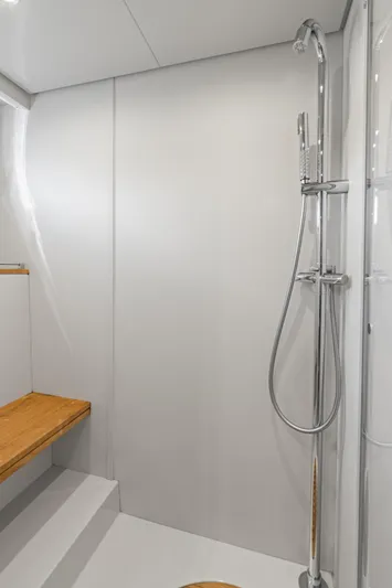 Wolverine Yacht Photos Pics Shower area in 2015 Riva 63 Virtus yacht with sleek design and wooden bench.