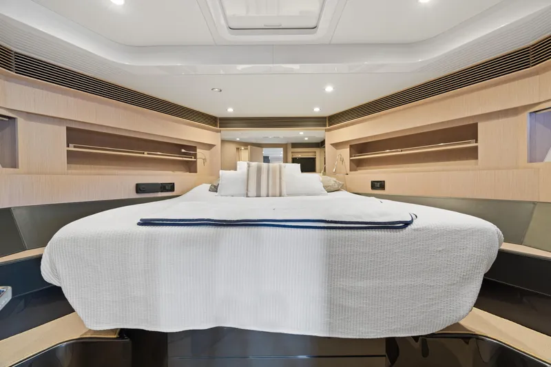 Wolverine Yacht Photos Pics Luxurious interior of 2015 Riva 63 Virtus yacht with elegant bedding and modern design.