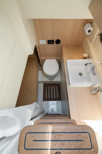 Wolverine Yacht Photos Pics 2015 Riva 63 Virtus yacht bathroom with modern sink and toilet.