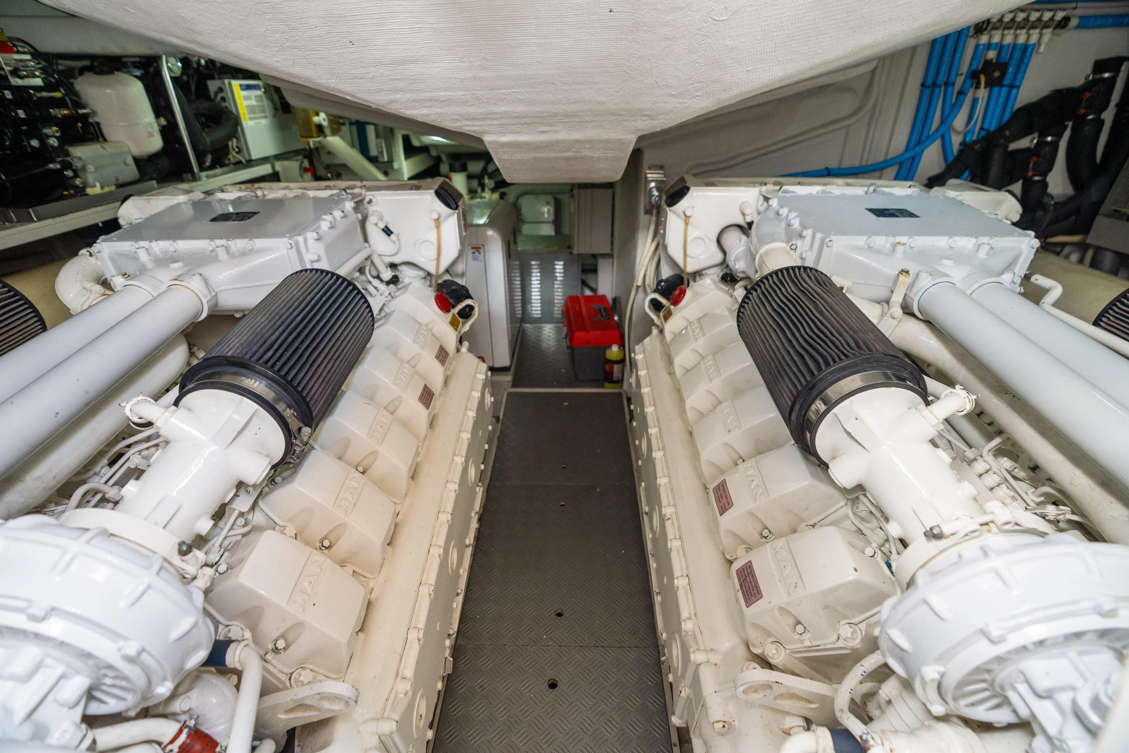 Wolverine Yacht Photos Pics Engine room of 2015 Riva 63 Virtus yacht, showcasing dual engines and mechanical components.