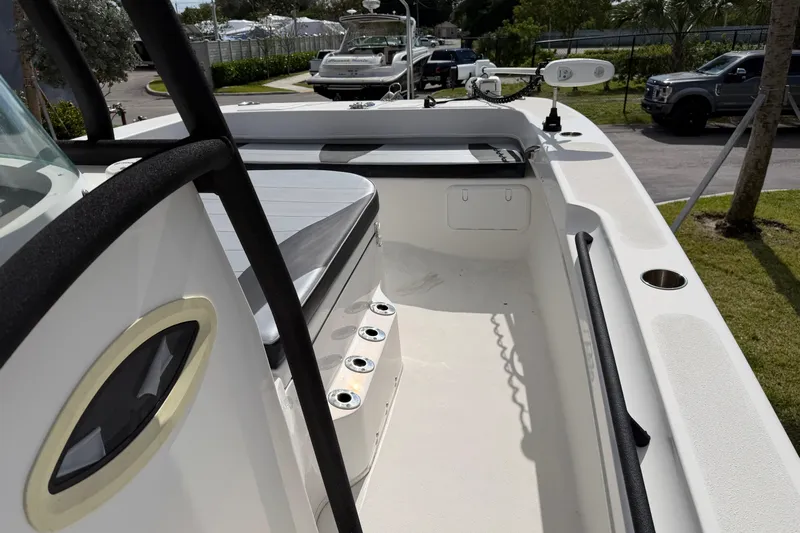  Yacht Photos Pics 2021 Twin Vee 310 CC GF boat interior with seating and rod holders.
