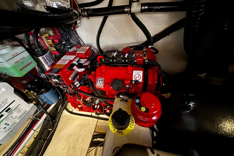  Yacht Photos Pics Engine compartment of 2023 Regal 33 Express boat, featuring a red EFI engine.