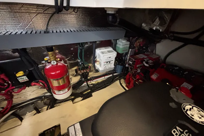  Yacht Photos Pics Engine room of 2023 Regal 33 Express with fire extinguisher and electrical components.