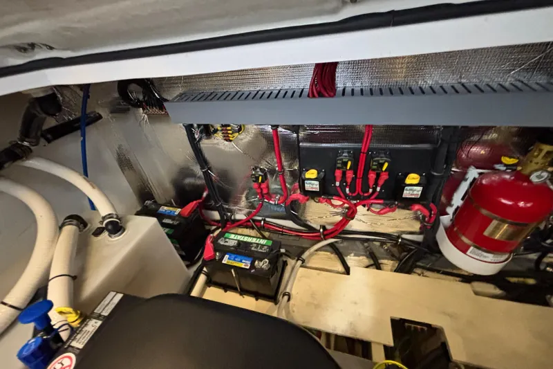  Yacht Photos Pics Engine compartment of 2023 Regal 33 Express boat with wiring and fire extinguisher.