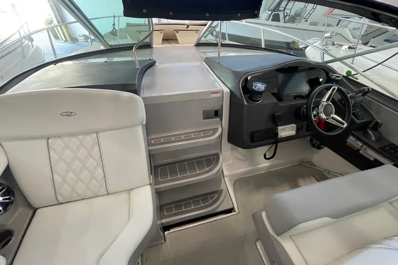  Yacht Photos Pics 2023 Regal 33 Express boat interior with helm, seating, and modern dashboard.