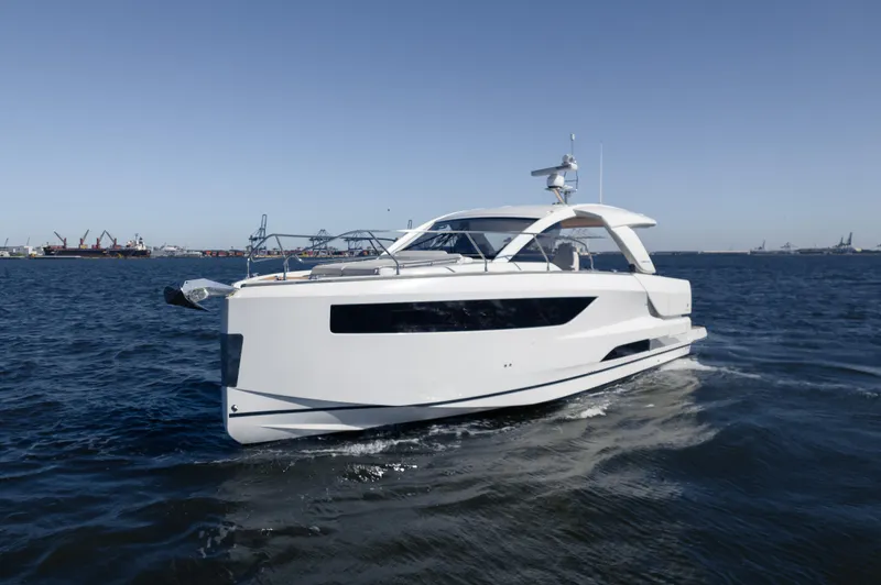  Yacht Photos Pics 2024 Jeanneau DB/43 OB yacht cruising on open water.