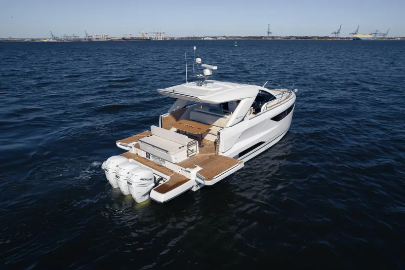  Yacht Photos Pics 2024 Jeanneau DB/43 OB yacht cruising on open water, showcasing sleek design and powerful engines.