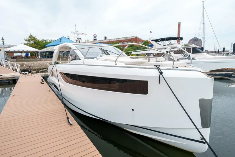  Yacht Photos Pics 2024 Jeanneau DB/43 OB yacht docked at a marina, showcasing sleek design and modern features.