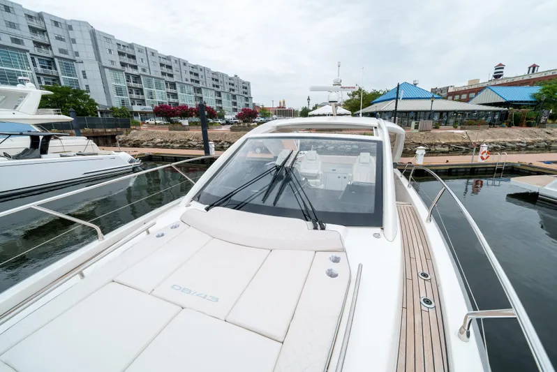  Yacht Photos Pics 2024 Jeanneau DB/43 OB yacht docked at a marina, showcasing sleek design and modern features.