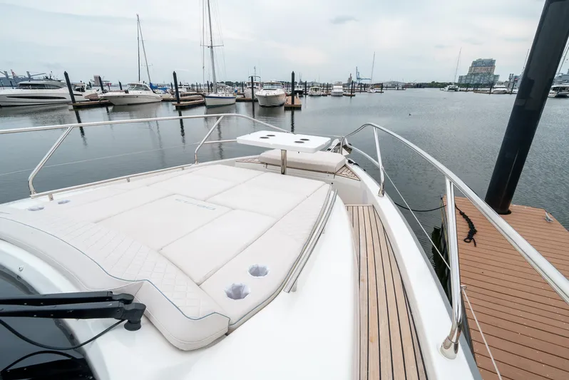  Yacht Photos Pics 2024 Jeanneau DB/43 OB yacht docked at marina, featuring spacious deck and sleek design.