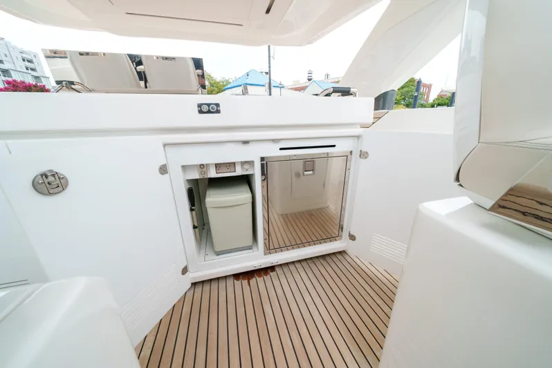  Yacht Photos Pics 2024 Jeanneau DB/43 OB yacht interior with sleek cabinetry and wooden flooring.